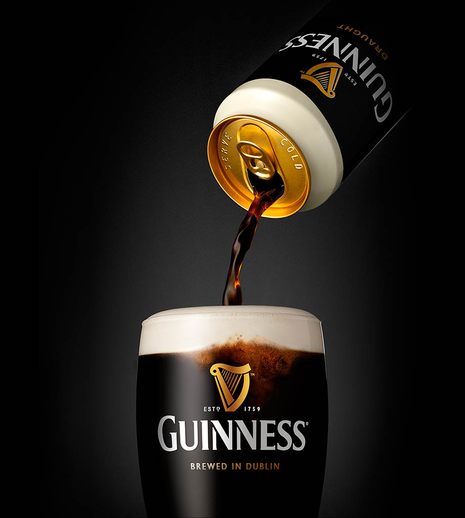 Packshot Factory - Black background - Guinness can and glass pour