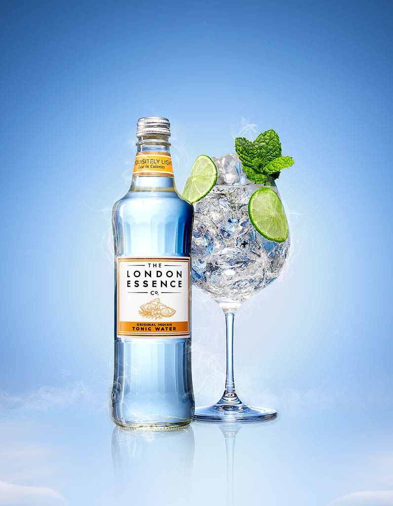 Packshot Factory - Coloured background - London Essence tonic water bottle and serve