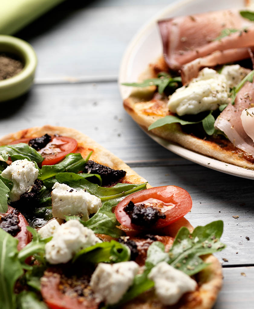 Food Photography of Jamie Oliver flat bread with feta parma ham and rocket by Packshot Factory