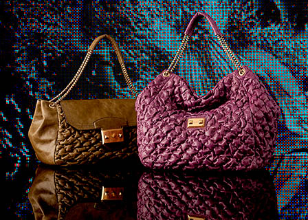 Coloured background Explorer of Alexander McQueen handbags