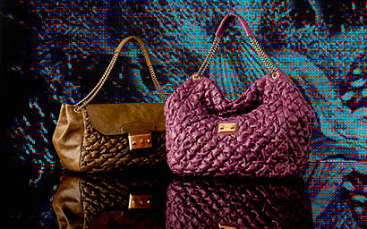 Coloured background Explorer of Alexander McQueen handbags