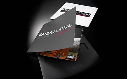 Black background Explorer of Sandy Plateau brochures