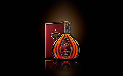 Black background Explorer of XO Courvoisier cognac bottle