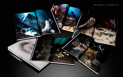 Black background Explorer of 125 Magazine spreads and cover