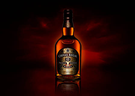 Coloured background Explorer of Chivas Regal whisky bottle