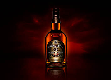 Coloured background Explorer of Chivas Regal whisky bottle