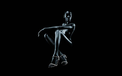Black background Explorer of Model in silver sandals