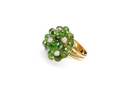 White background Explorer of Gold ring with emeralds