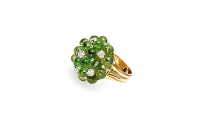 White background Explorer of Gold ring with emeralds