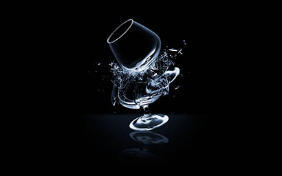 Black background Explorer of Cognac glasses smashed