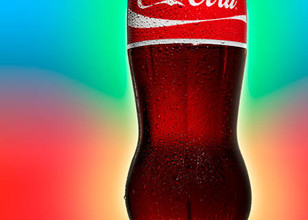 Coloured background Explorer of Coca Cola bottle