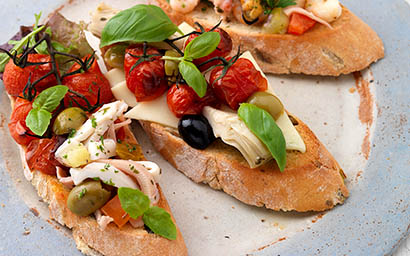 Fruits and vegetables Explorer of Calamari and cherry tomatoes baguette