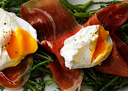 Meat Explorer of parma ham and poached egg salad