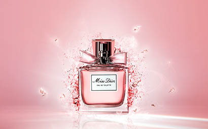 Coloured background Explorer of Miss Dior perfume bottle