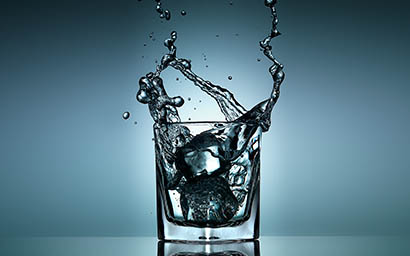 Liquid Explorer of Water splash in glass with ice