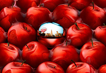 Coloured background Explorer of DKNY Red Delicious fragrance bottle