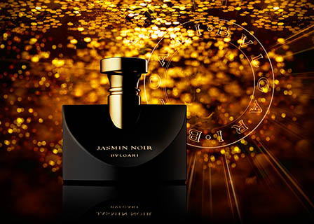 Coloured background Explorer of Bulgari Jasmin Noir perfume bottle