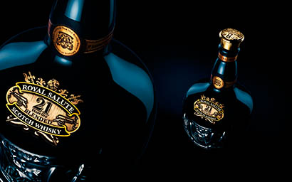 Black background Explorer of Chivas Royal Salute whisky bottle