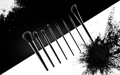 Powder Explorer of Illamasqua makeup brushes and powder spill