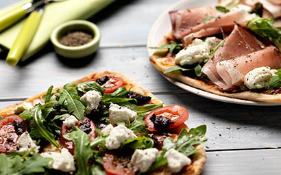 Food Photography of Jamie Oliver flat bread with feta parma ham and rocket