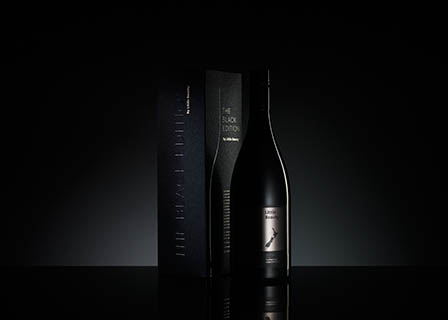 Black background Explorer of Little Beauty wine and box