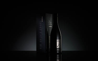 Black background Explorer of Little Beauty wine and box