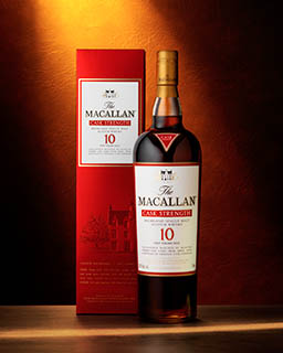 Coloured background Explorer of Macallan whisky bottle