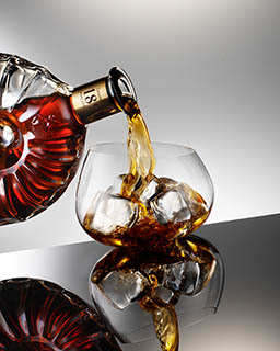 Glass Explorer of Remy Martin cognac bottle and serve pour
