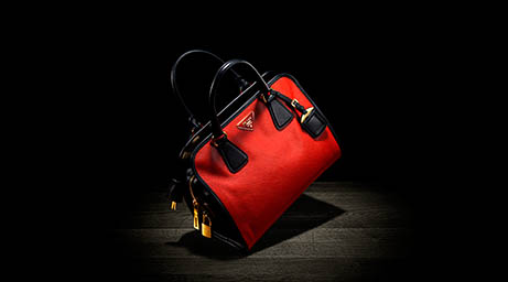 Black background Explorer of Prada handbag