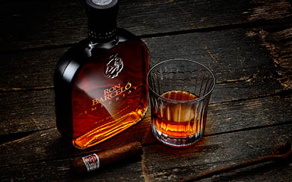 Drinks Photography of Ron Barcelo rum bottle and serve