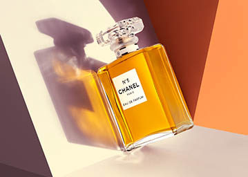 Coloured background Explorer of Chanel perfume bottle
