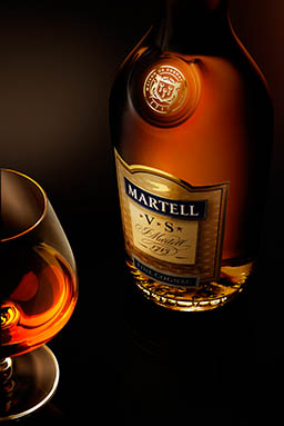 Glass Explorer of Martell VS cognac bottle and serve
