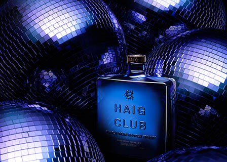 Coloured background Explorer of Haig Club whisky bottle