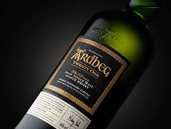 Black background Explorer of Ardbeg whisky bottle label close up