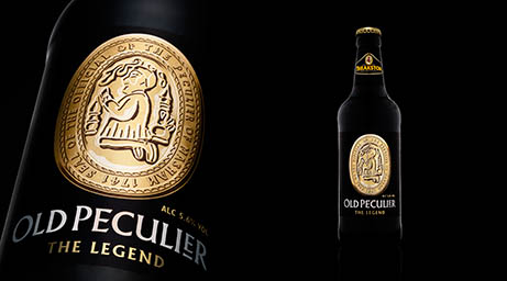 Black background Explorer of Old Peculier beer bottle