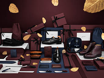 Coloured background Explorer of John Lobb men's leather shoes and accessories