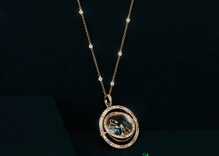 Coloured background Explorer of Loquet London gold necklace with diamonds