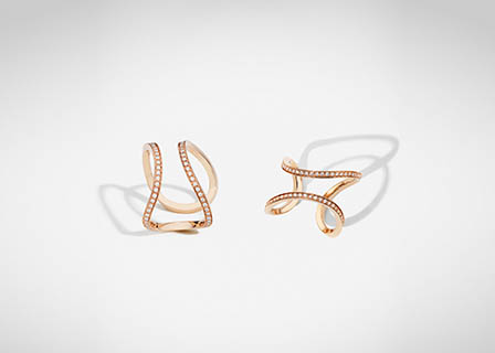 White background Explorer of Maison Dauphin gold rings with diamonds
