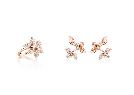 White background Explorer of Gold ring and stud diamond earrings set
