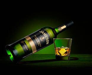 Glass Explorer of Jameson whisky bottle and serve