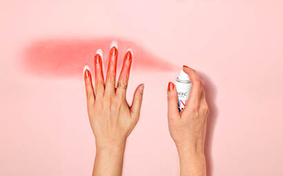 Coloured background Explorer of Nails Inc spray on nail polish