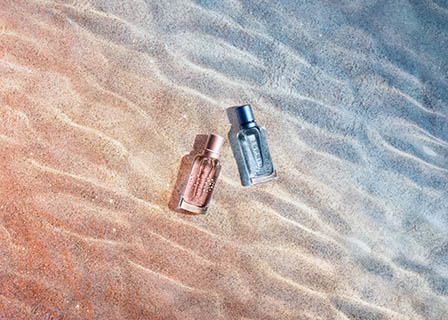 Coloured background Explorer of Esprit fragrance bottles