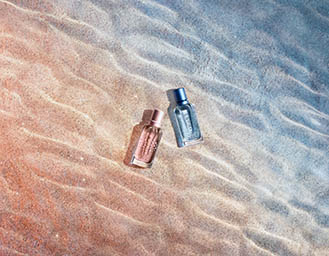 Coloured background Explorer of Esprit fragrance bottles