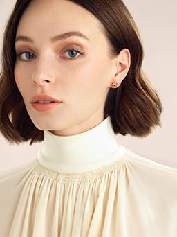 Model Explorer of Annoushka jewellery stud earrings