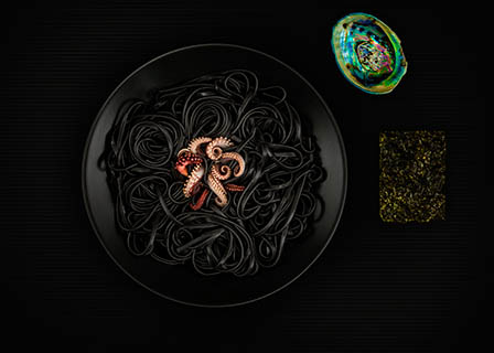 Black background Explorer of Barilla black squid ink pasta