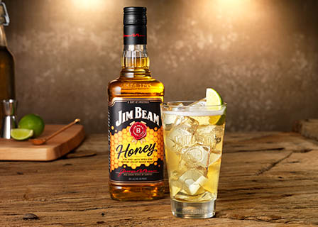 Drinks Photography of Jim Beam Honey bourbon whiskey bottle and serve