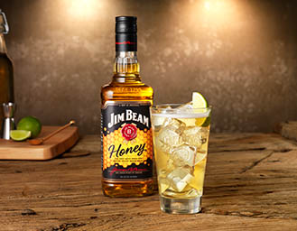Drinks Photography of Jim Beam Honey bourbon whiskey bottle and serve