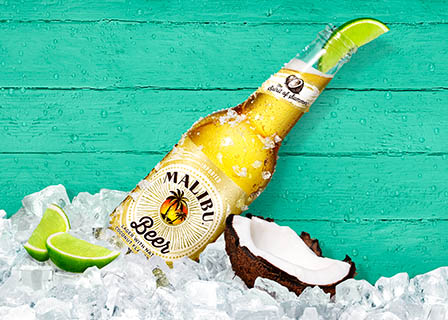 Coloured background Explorer of Malibu beer bottle with lime