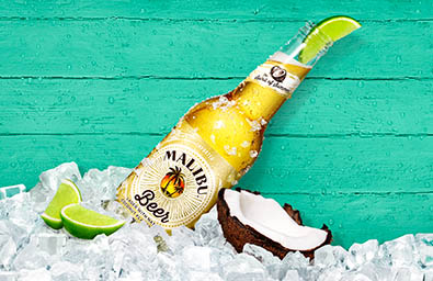 Coloured background Explorer of Malibu beer bottle with lime