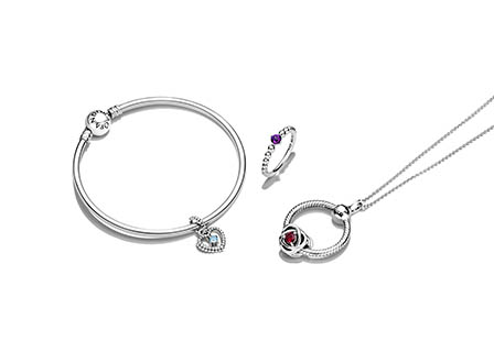White background Explorer of Pandora jewellery bracelet ring and necklace set